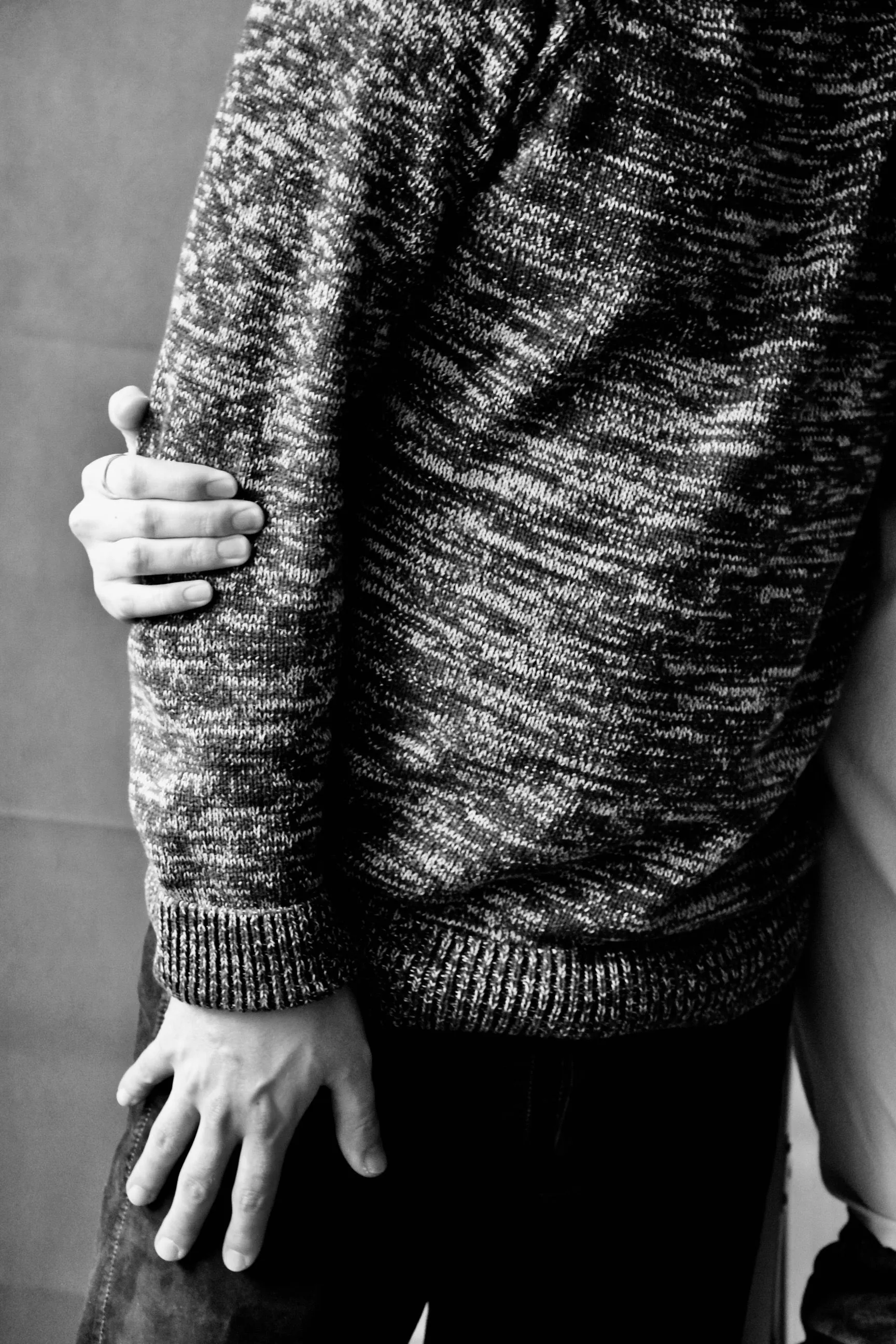 A close-up of one person gently embracing another, symbolizing comfort, love, and emotional support.